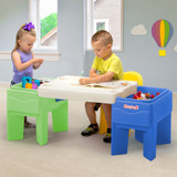 two children playing with desk, one seated with the play around storage chair, not included