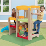 Kids playing on back side of Simplay3 Adventure Climber shown in a playroom