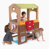 Kids playing on Young Explorers Indoor/Outdoor Discovery Playhouse with easel and crawl through spaces