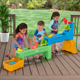Children playing outside around Simplay3 Rushing River Falls Water Play Table