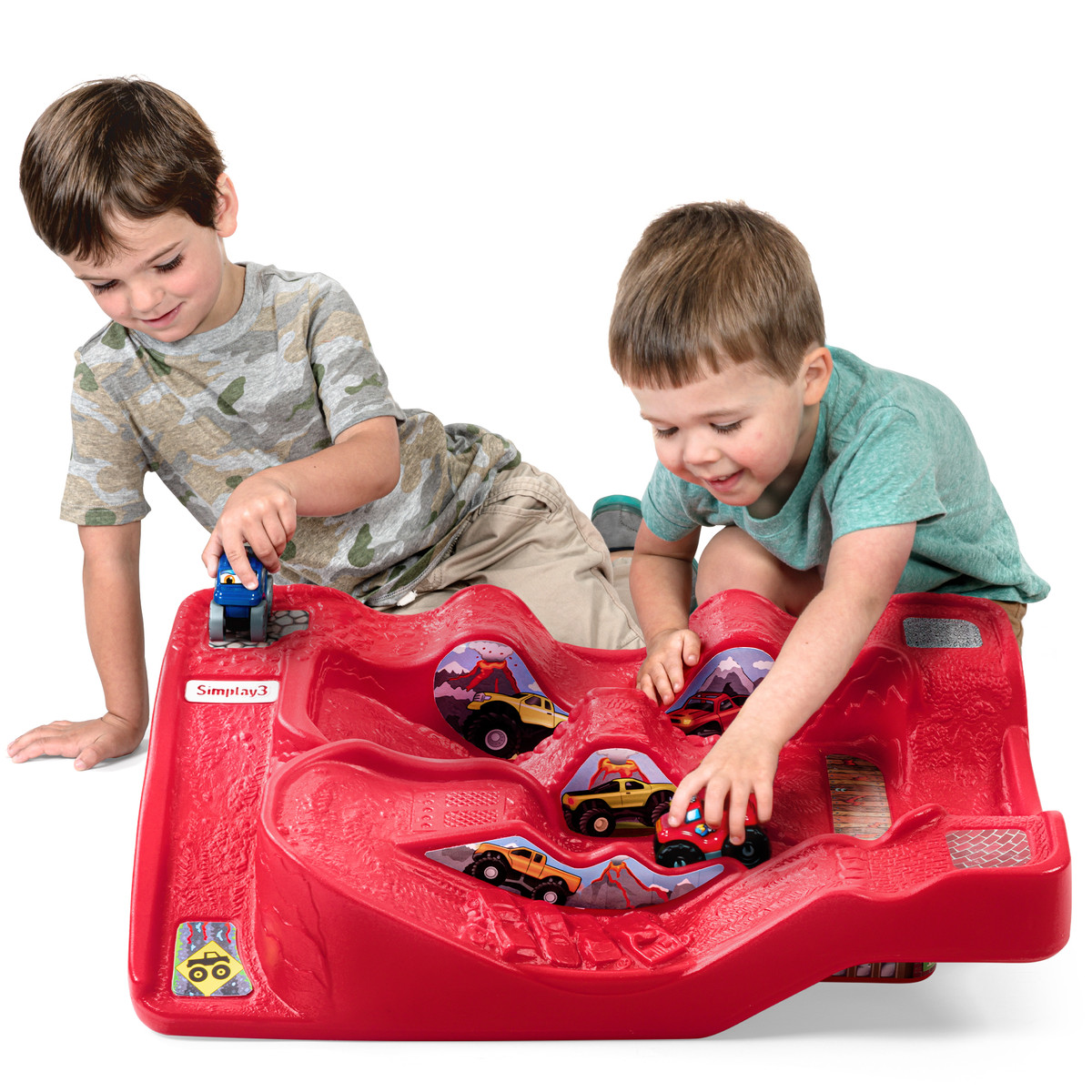 Two boys playing with red Simplay3 Monster City Extreme Wheels track