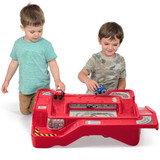 Two boys playing with Simplay3 Monster City Extreme Wheels track