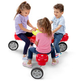 Three children riding the Simplay3 Boomerang Trike