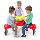 Three children riding the Simplay3 Boomerang Trike