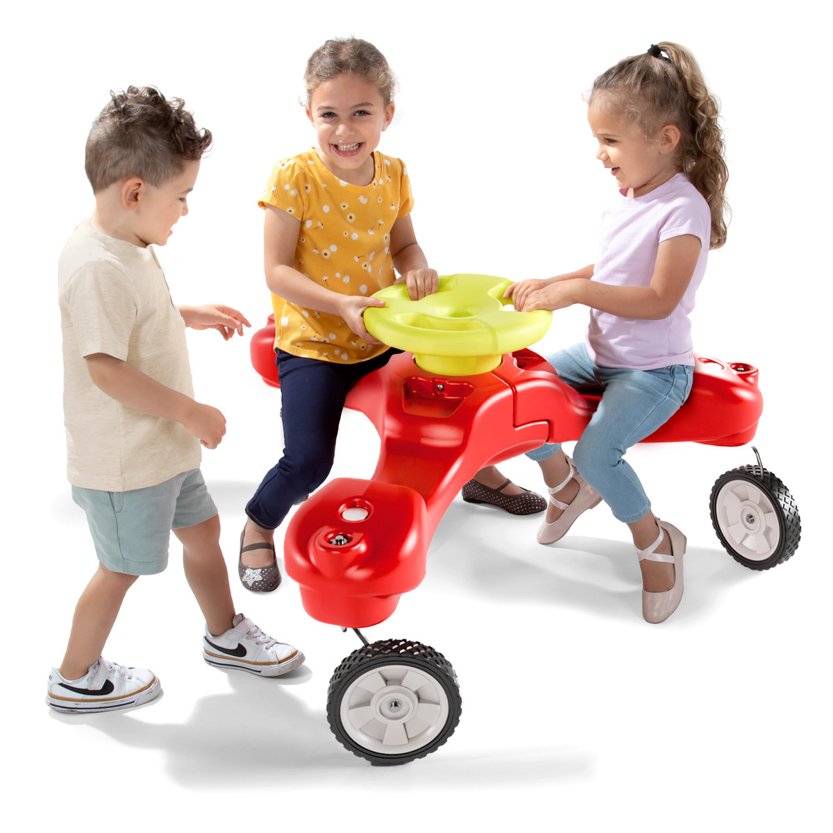 Simplay3 Boomerang Trike with two girls seated and one boy getting on