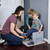 Simplay3 Sibling Step Stool used as a seat for putting on children's shoes